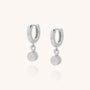 A pair of Gem Hoop Birthstone Earrings in sterling silver with round, light gemstone charms dangling from each hoop, displayed on a plain light background.