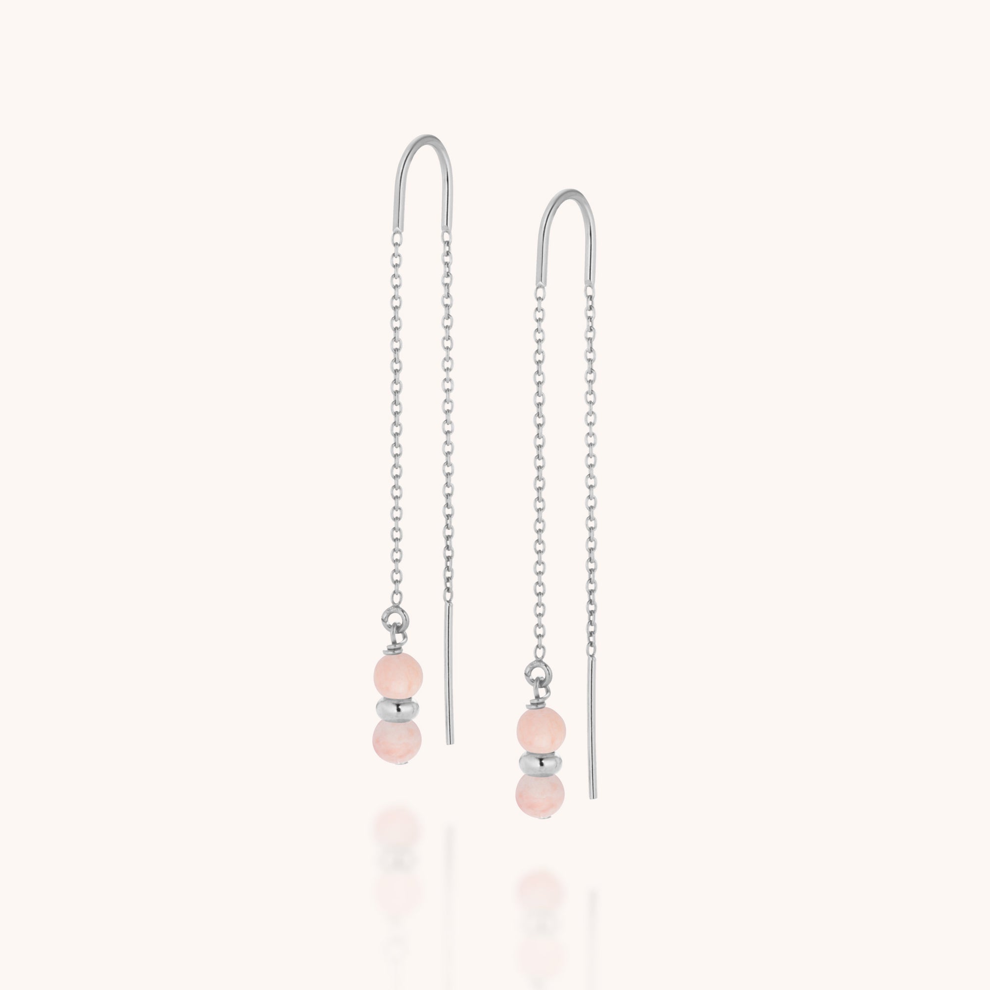Fall Earrings Birthstone October: Sterling silver threader earrings with delicate chains, each featuring two small round Pink Opal beads and a silver spacer at the end. Displayed on a soft off-white background.