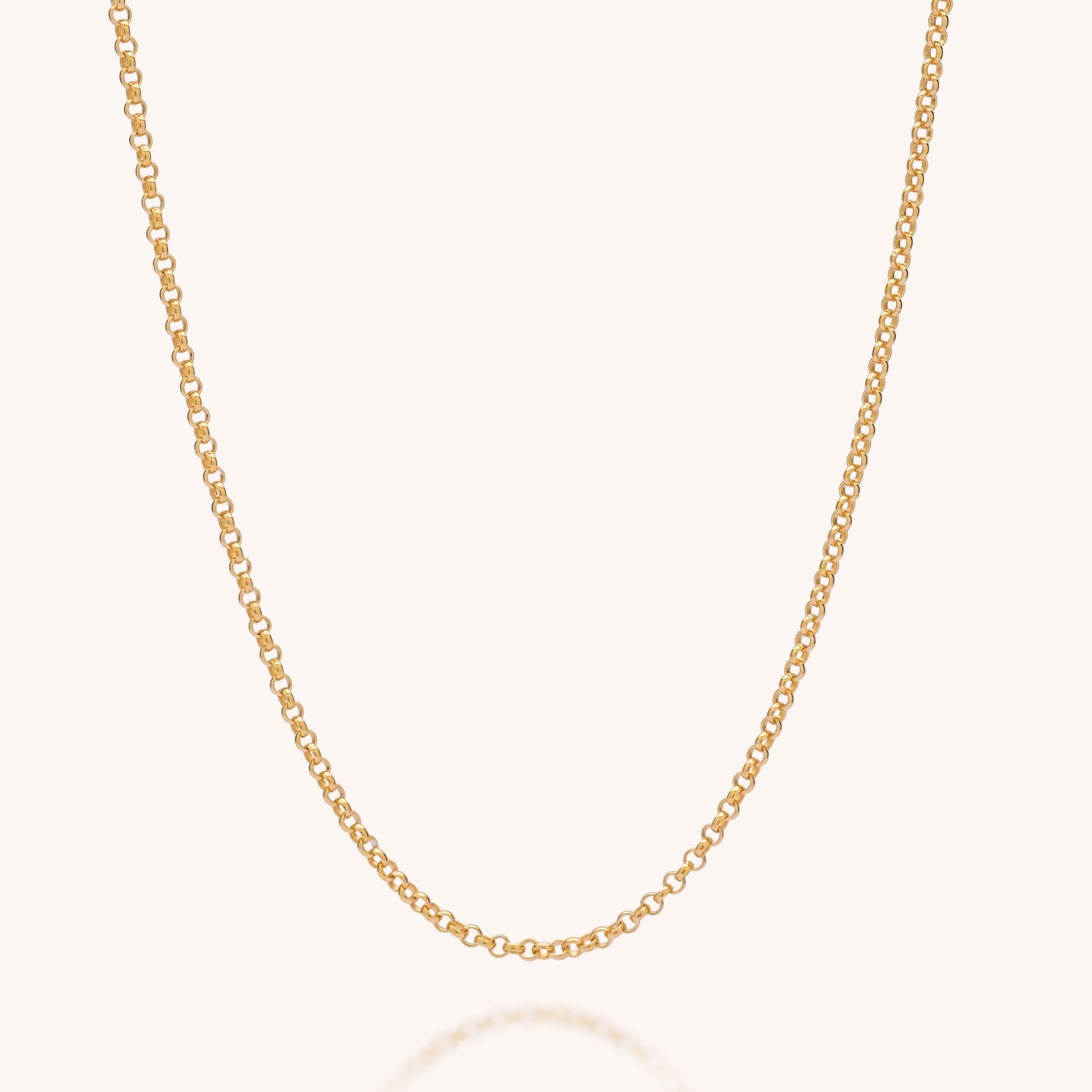The Belcher Chain Necklace features small, round links crafted in 925 sterling silver and is shown against a light, neutral background.