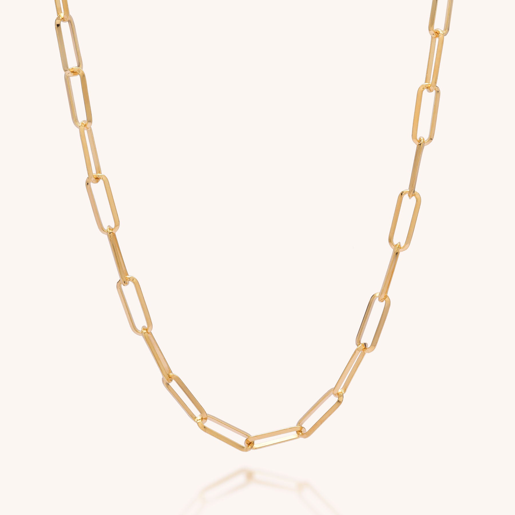 The Triangular Paperclip Necklace, crafted from eco silver with elongated oval links, is displayed on a plain light background, showcasing its simple and elegant sustainable design.