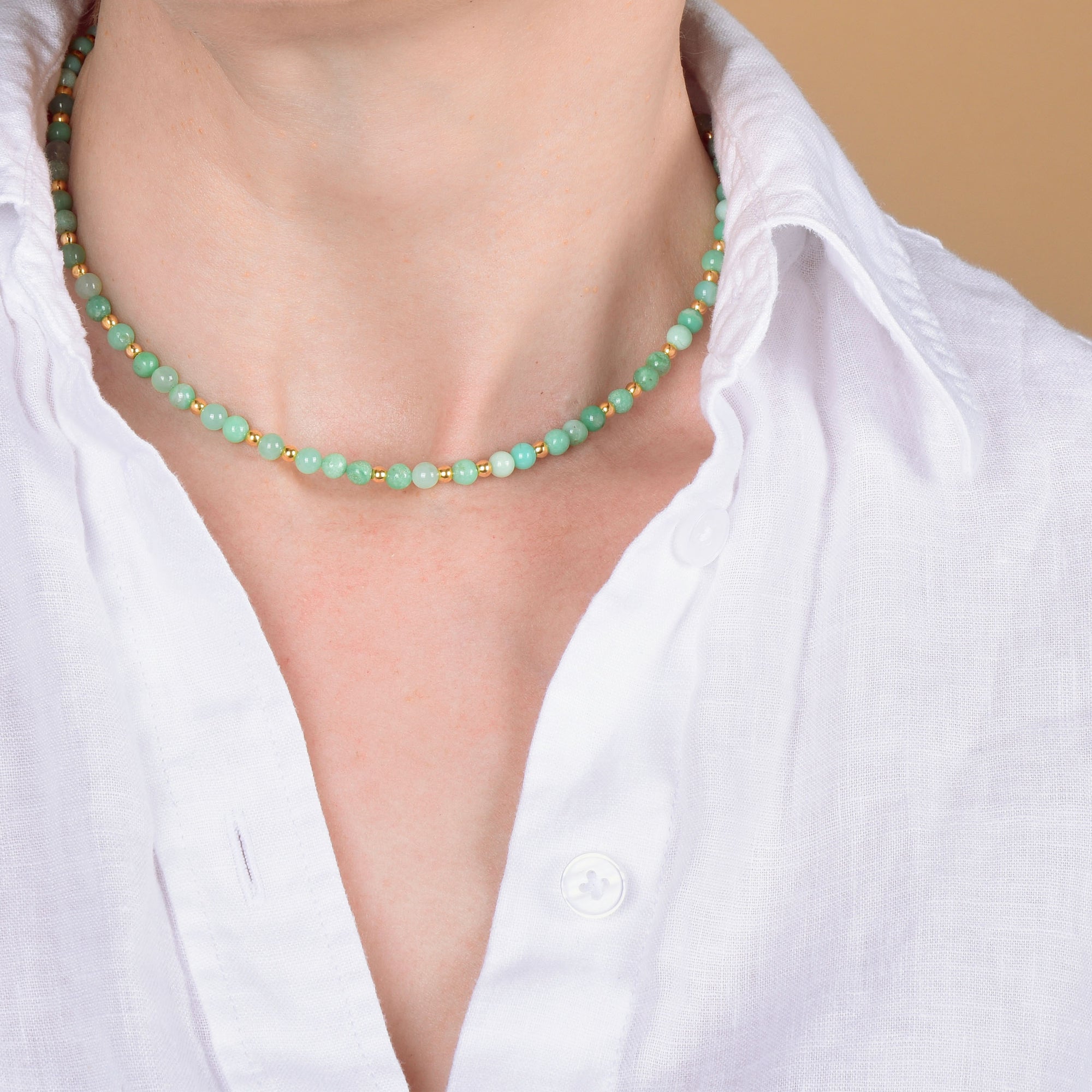 Chrysoprase birthstone necklace with an open shirt