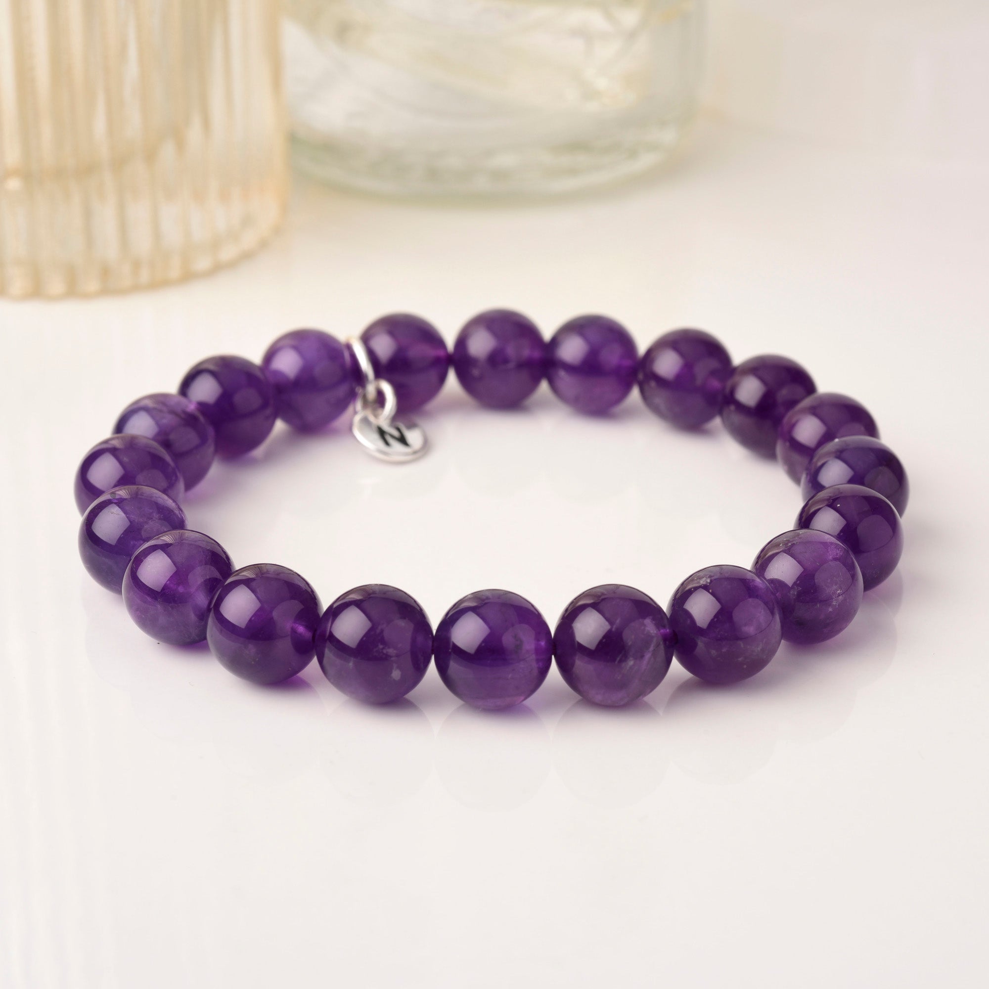 Amethyst bead bracelet with silver N tag