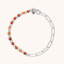 The Gem Shine Bracelet showcases alternating orange natural gemstones and eco-silver sterling beads on one half, with silver chain links, a circular clasp, and an engraved N charm.