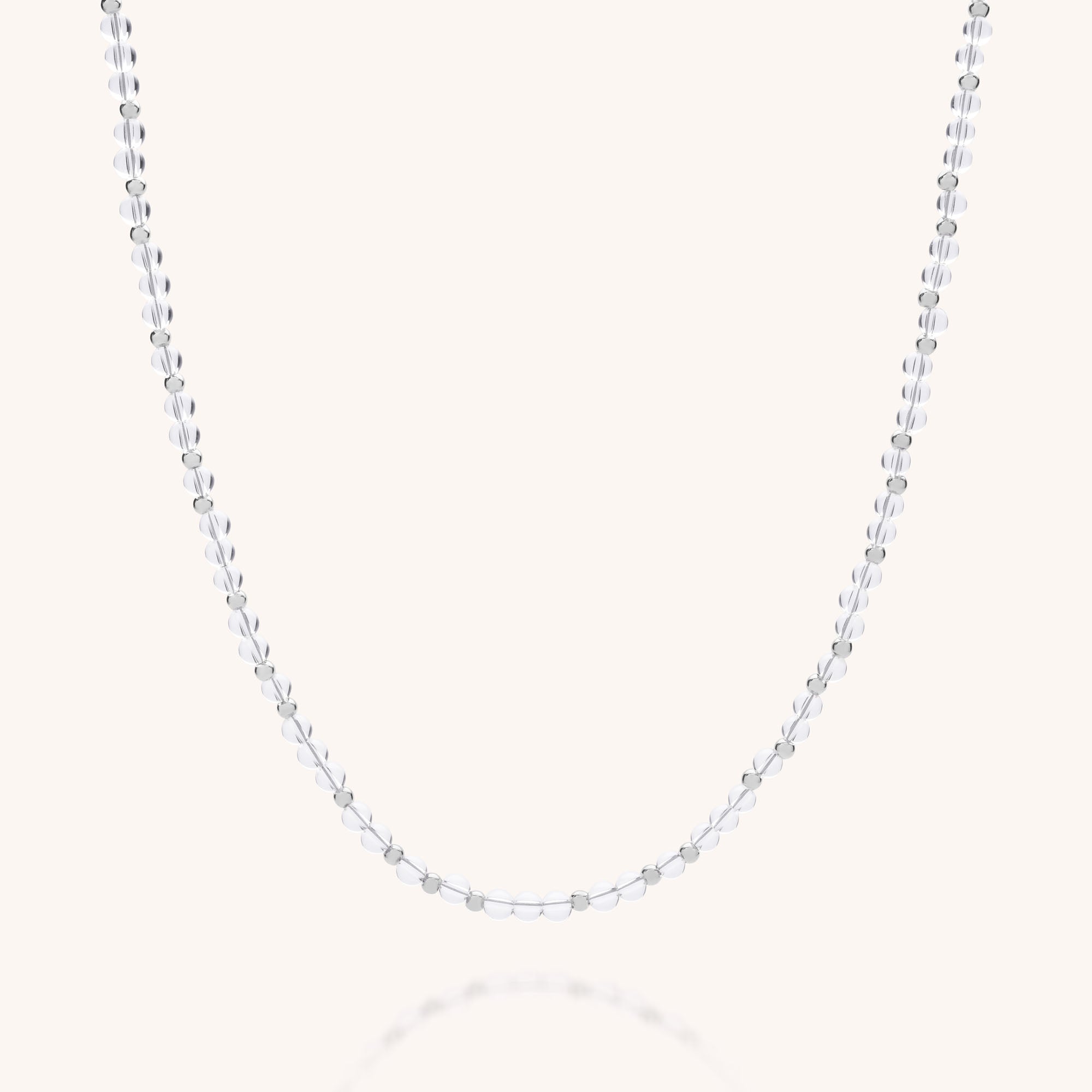 The Jewel Bead Birthstone Necklace – April is a delicate, eco-friendly sterling silver chain with small, evenly spaced round beads, handmade in the UK and displayed against a simple light background.