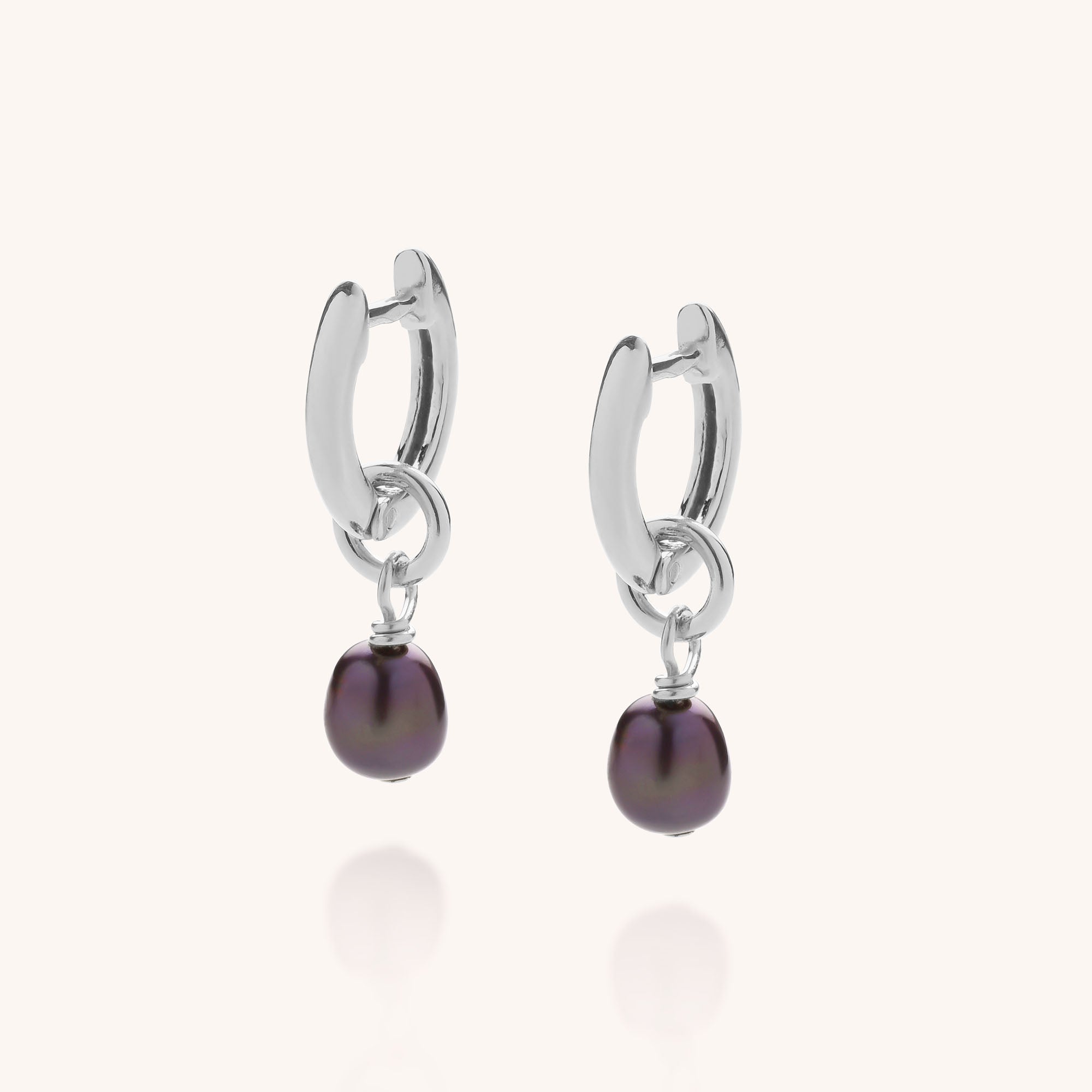 Mini peacock freshwater pearls dropped from a silver ear hoop