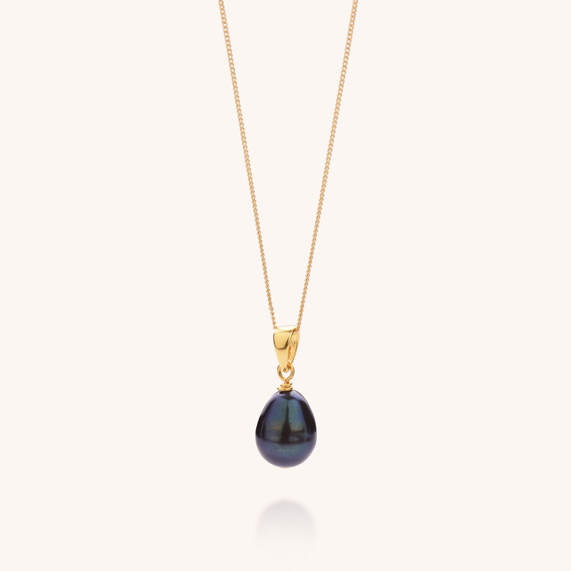 necklace with pearl pendant in peacock on gold chain