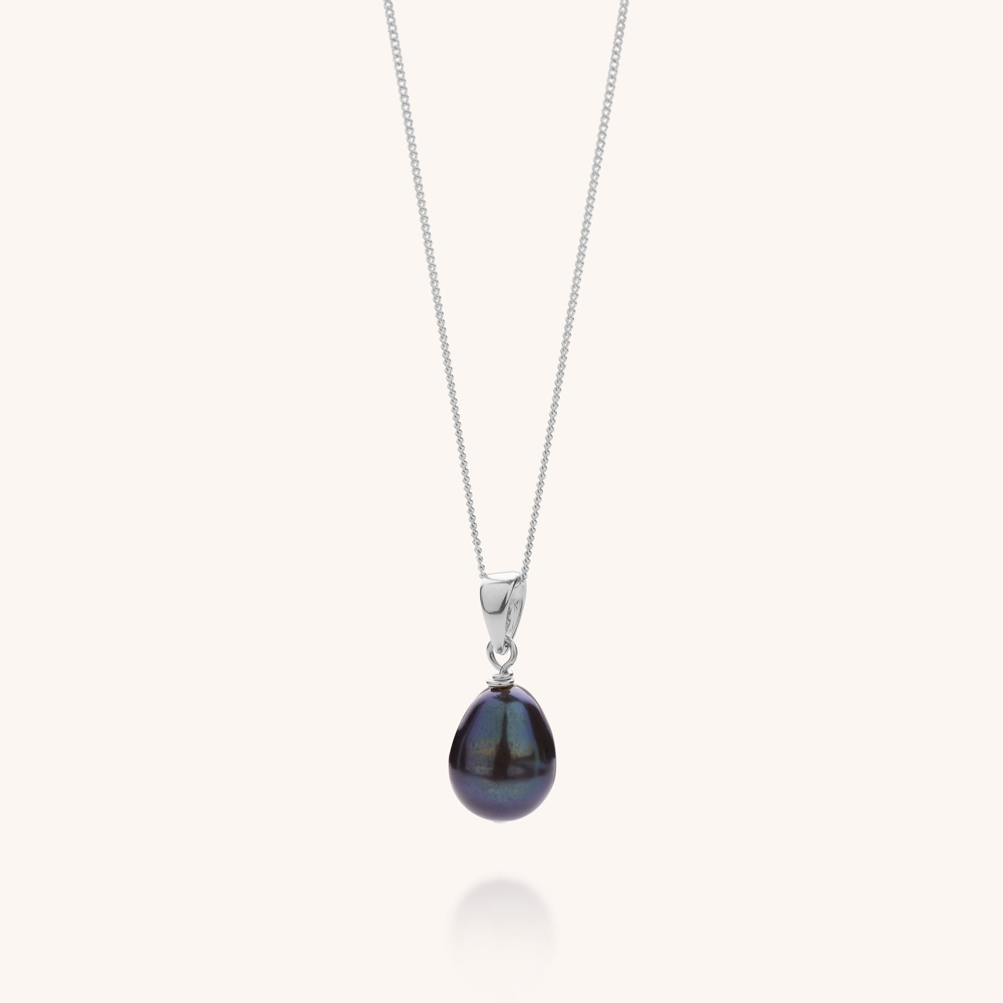 necklace with pearl pendant in peacock on silver chain