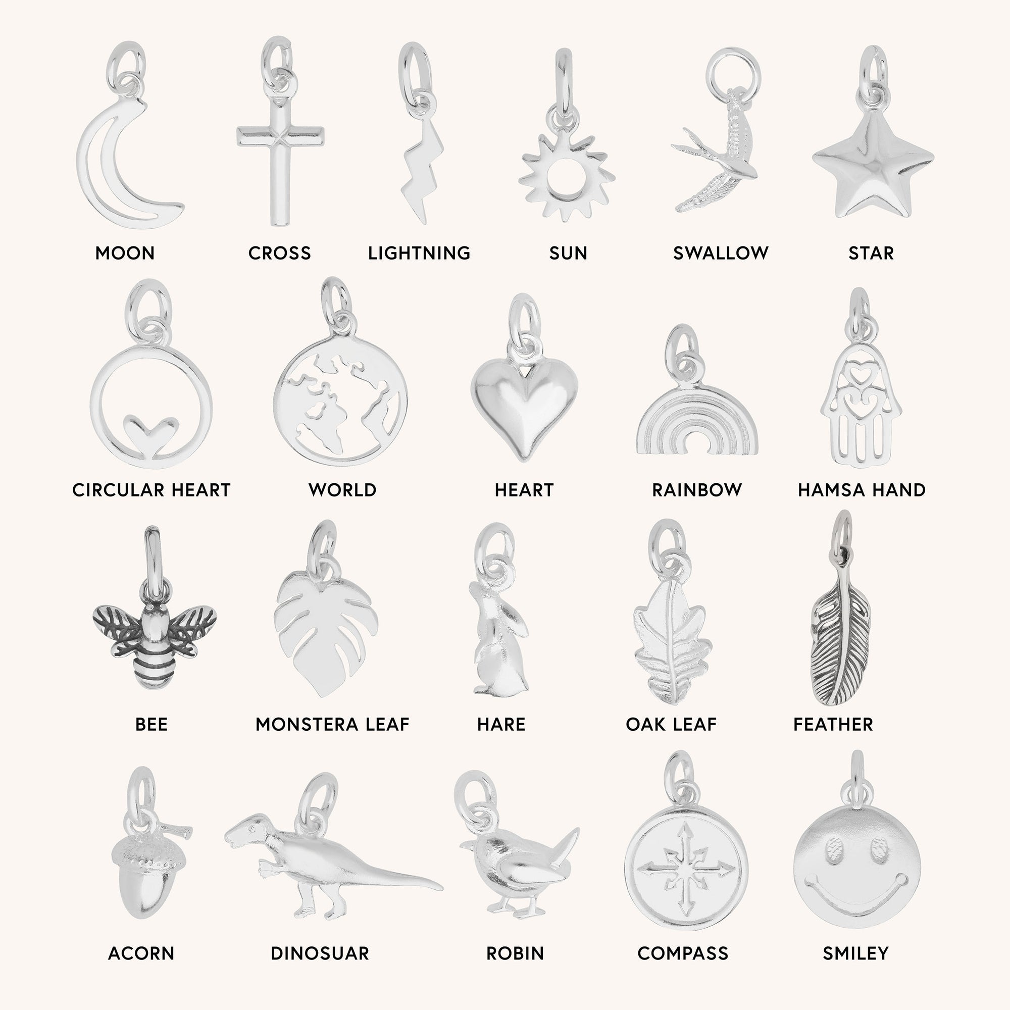 Twenty silver charms, each a unique shape—moon, cross, lightning bolt, sun, bird and more—hang from the Belcher Chain. All are crafted from eco sterling silver for a sustainable finish.