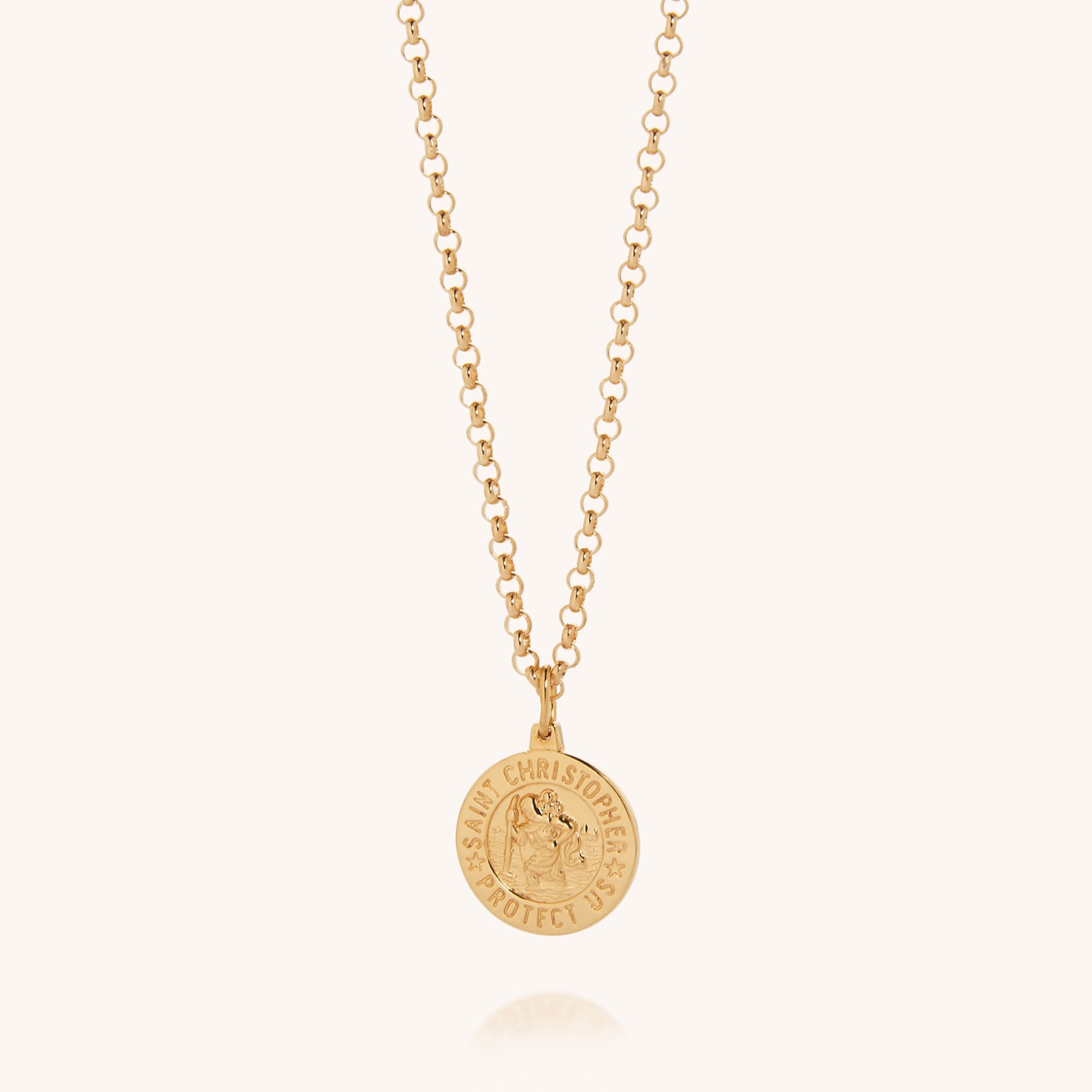 The Saint Christopher Necklace is made from eco-friendly sterling silver with an 18ct gold-plated finish. It features a round pendant engraved with Saint Christopher and the words SAINT CHRISTOPHER PROTECT US.