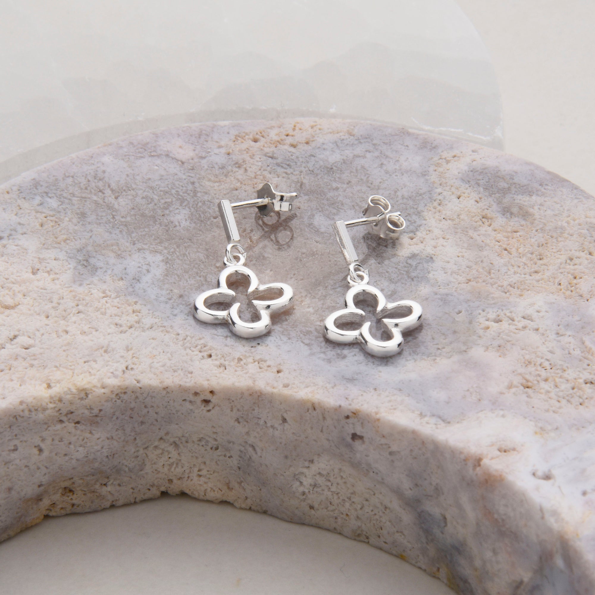 clover ear drops on pink amethyst gemstone
