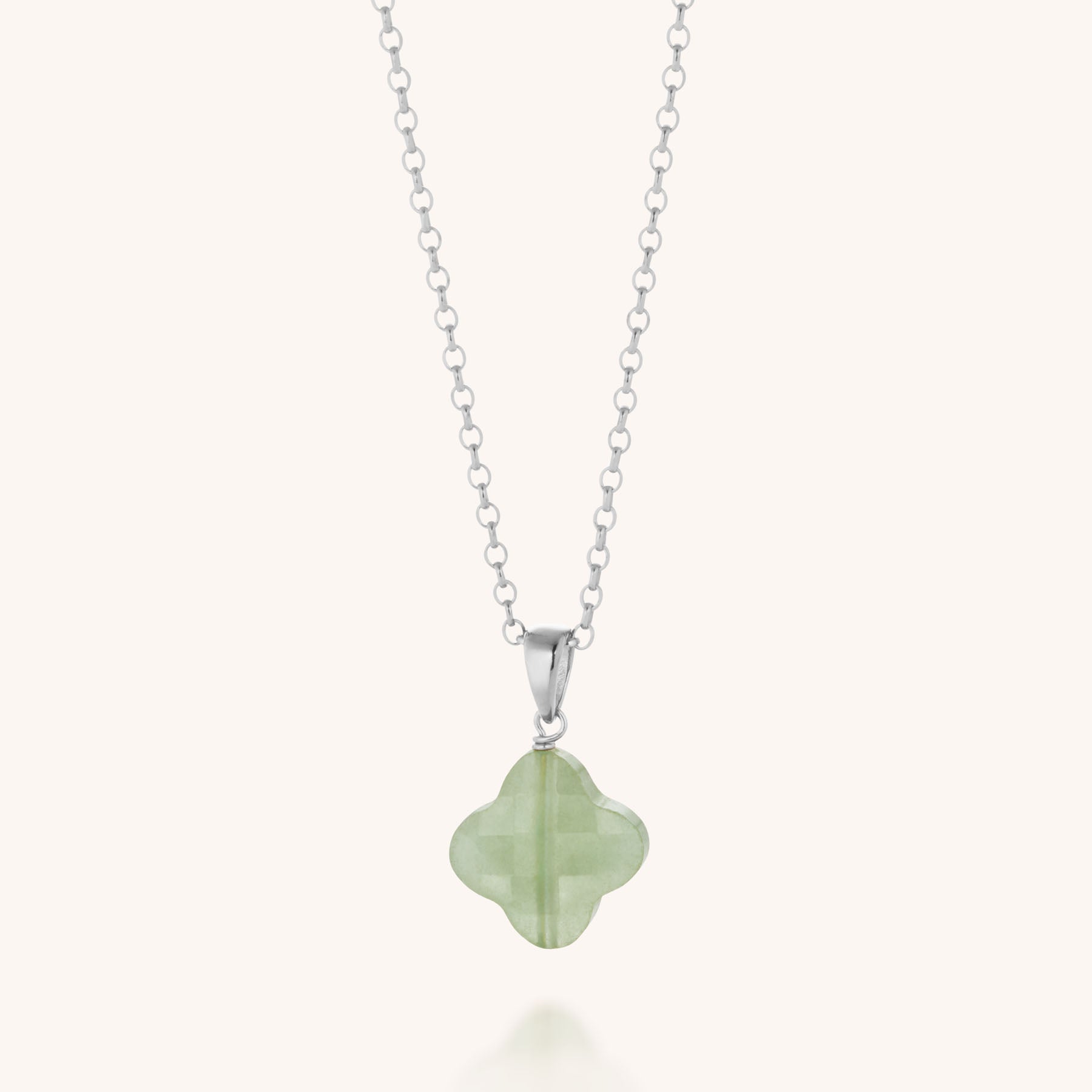The Gem Clover Necklace features a light green gemstone clover pendant on an eco-silver chain, showcasing a smooth, polished finish and timeless elegance.