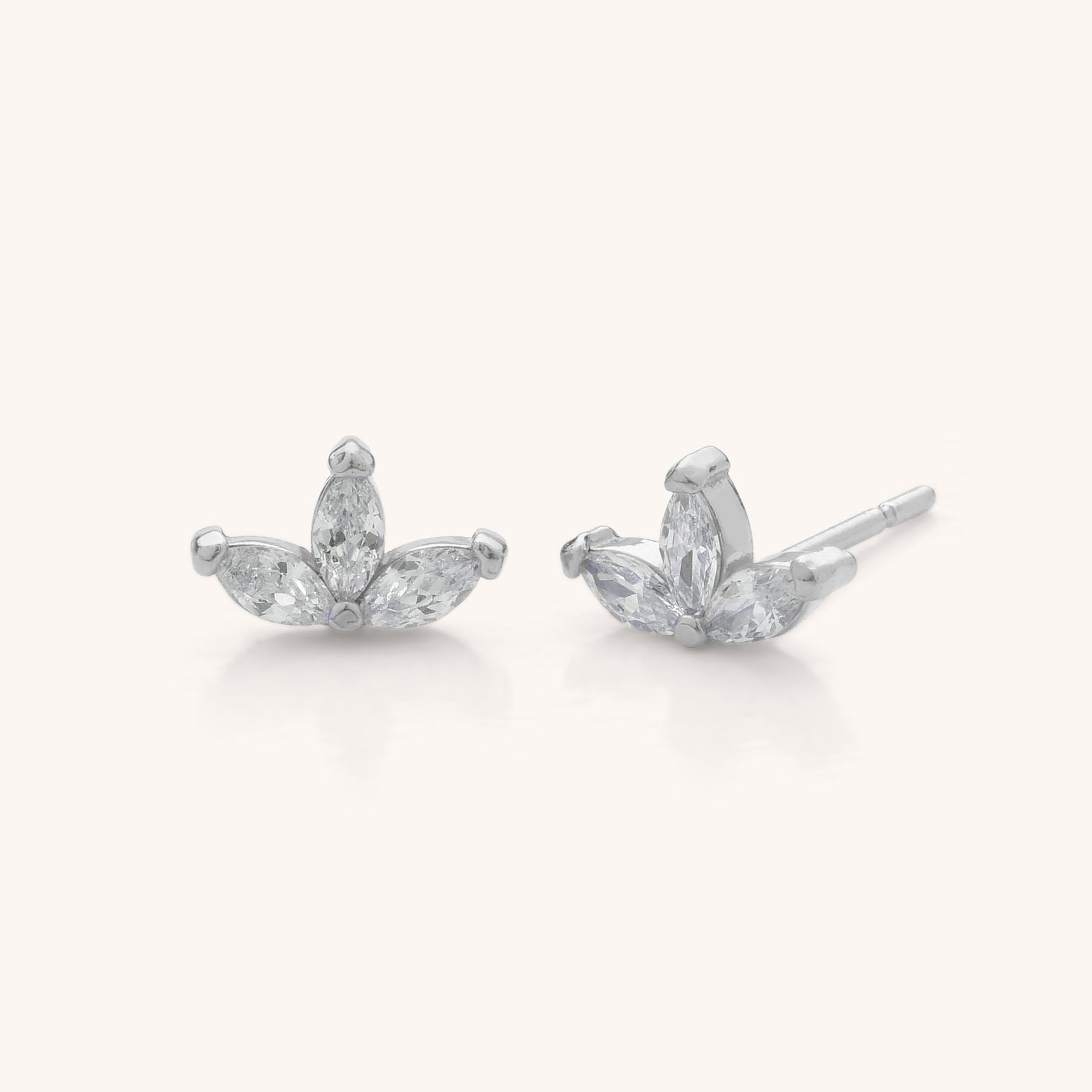 The Trio Leaf Stud Earrings, made from 925 silver, feature three marquise-cut clear cubic zirconia in a fan or petal shape, displayed against a plain light background.