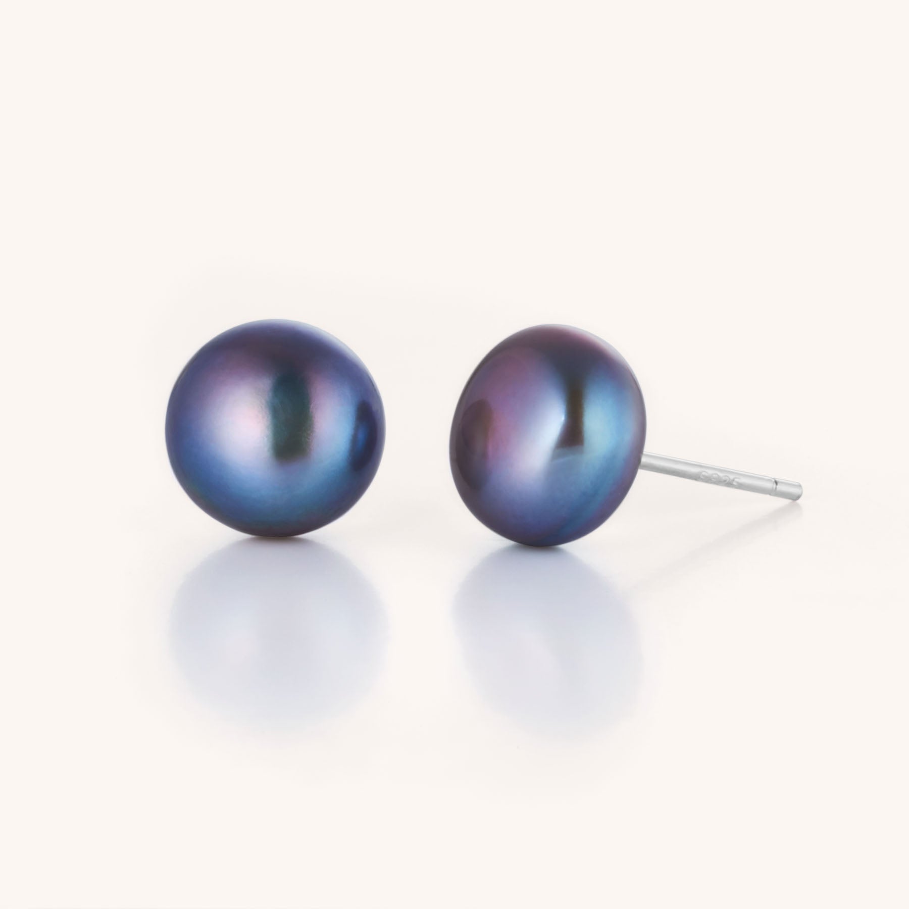 Large Pearl Button Stud Earrings featuring iridescent dark blue pearls on silver posts, displayed on a white background—a luxurious statement piece for sophisticated jewelry lovers.