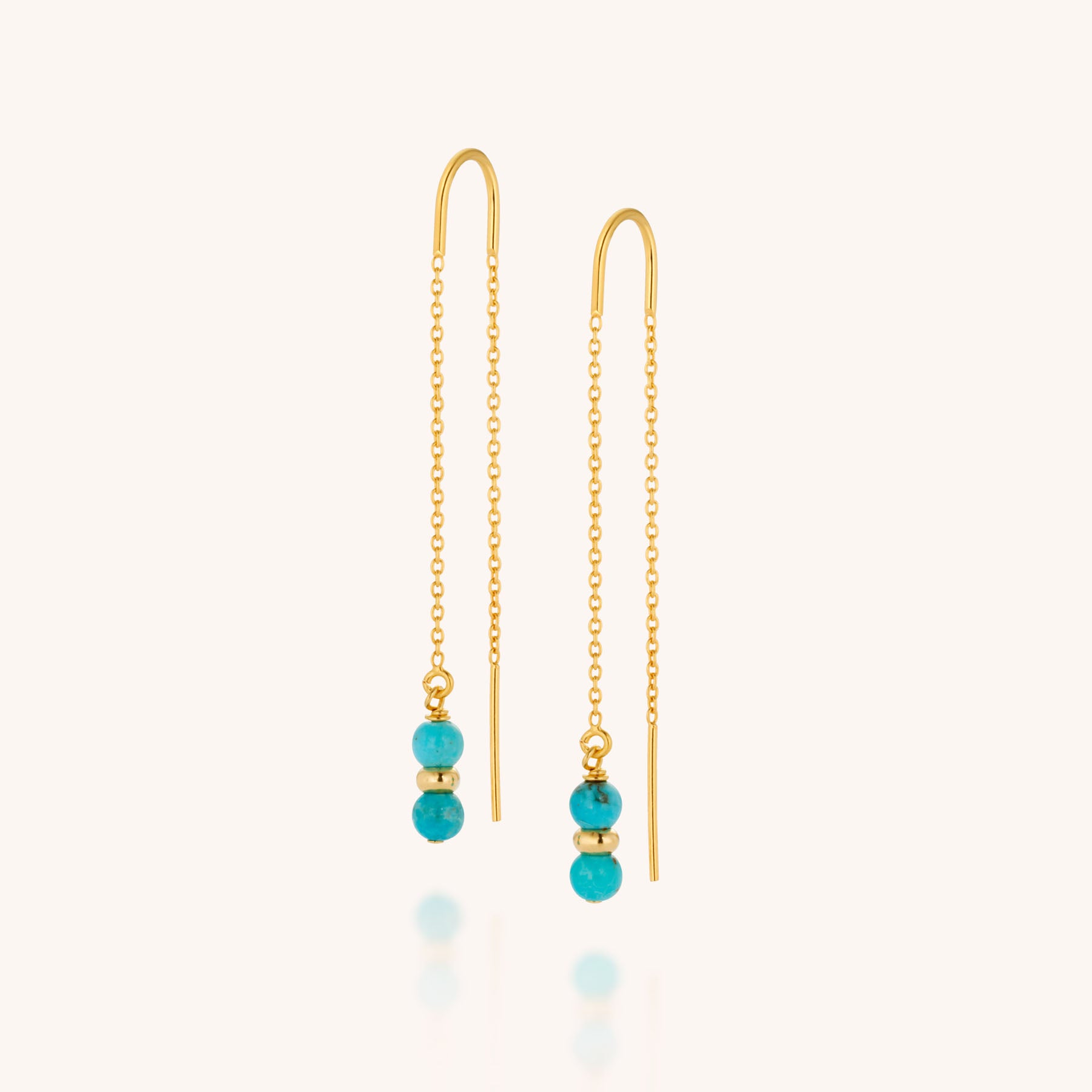 Fall Earrings Birthstone December: Gold pull-through chain earrings with two vibrant turquoise beads and a small gold bead on each, elegantly displayed on a light background.