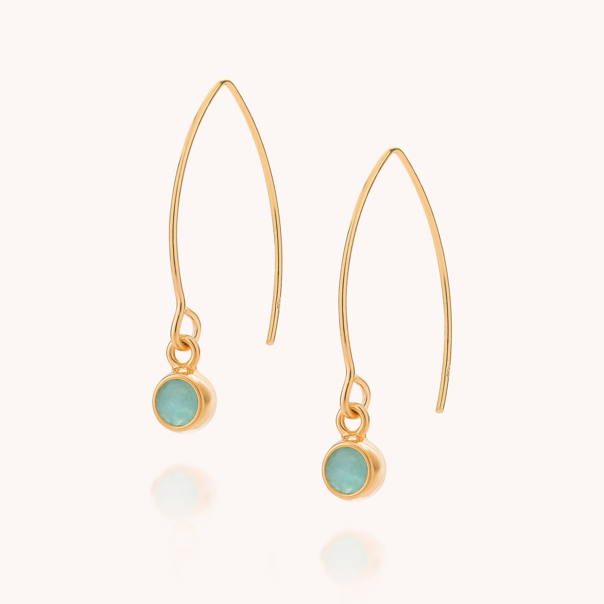 Amazonite Gem Dot Arc Earrings feature thin, curved gold hooks and small round amazonite stones set in gold bezels; these elegant gemstone drop earrings are displayed on a plain light background.