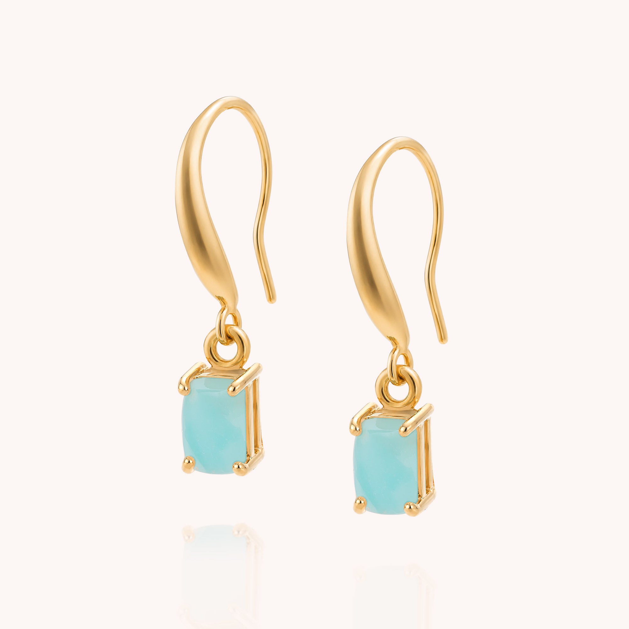 Amazonite Octavia Drop Earrings featuring rectangular turquoise Amazonite stones in prong settings and curved gold hooks, displayed against a light beige background—ideal for those who love the elegance of Amazonite drop earrings or the distinctive style of octagonal gemstone designs.
