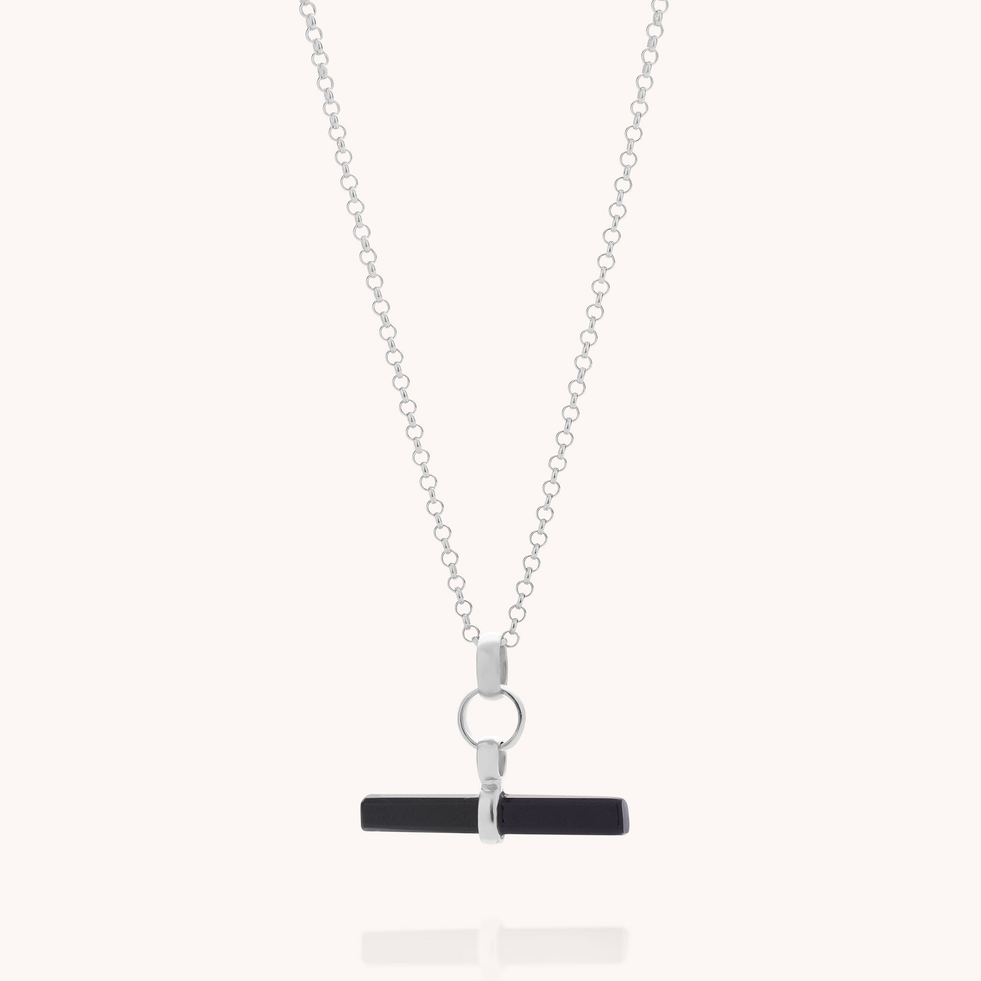 Black Onyx T-Bar Necklace featuring a silver chain with a circular ring and a sleek horizontal black T-bar pendant at the center, photographed against a plain light background.