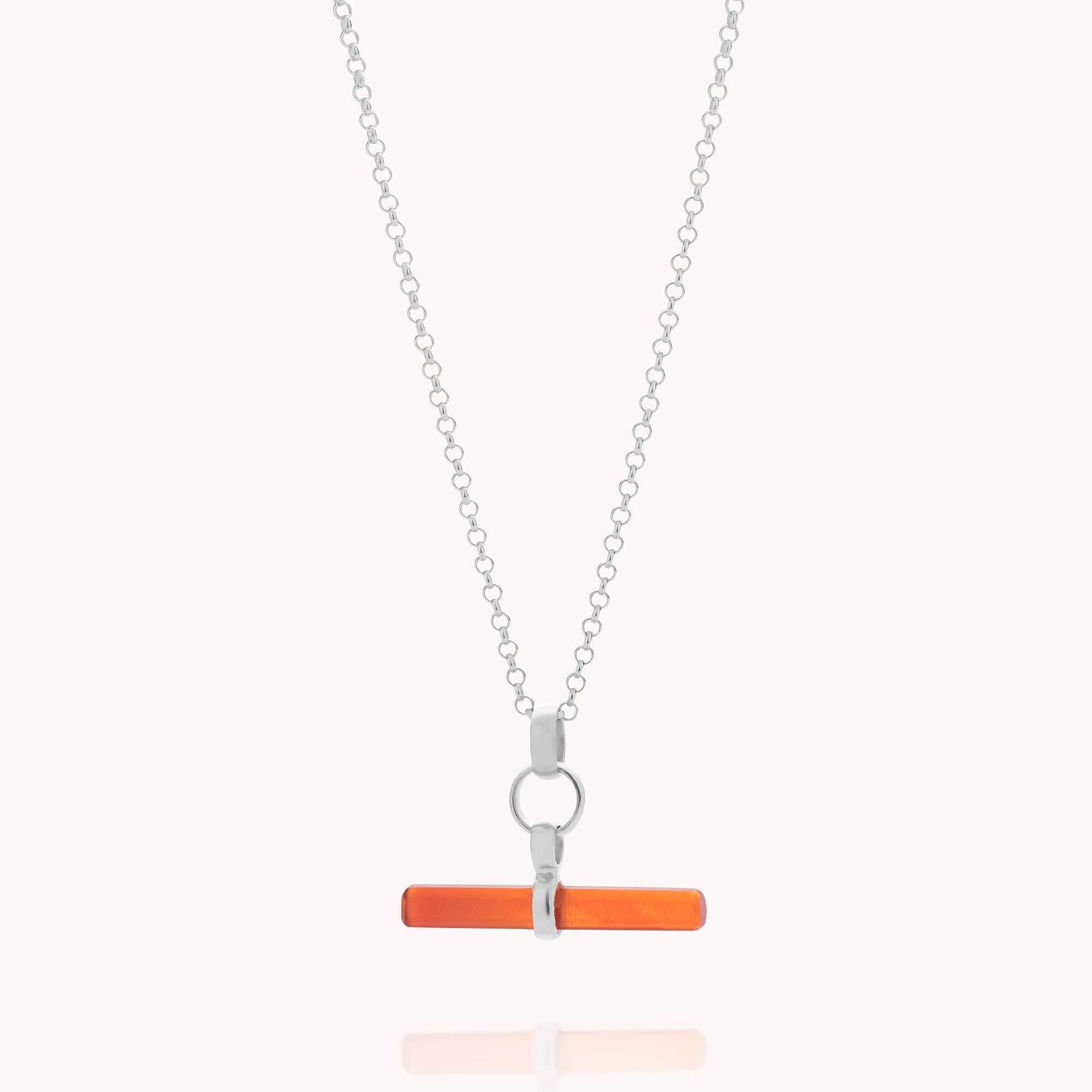 The Gemstone T Bar Necklace features a horizontal rectangular orange gemstone bar pendant on a silver chain, attached with a looped silver connector and displayed against a light backdrop.