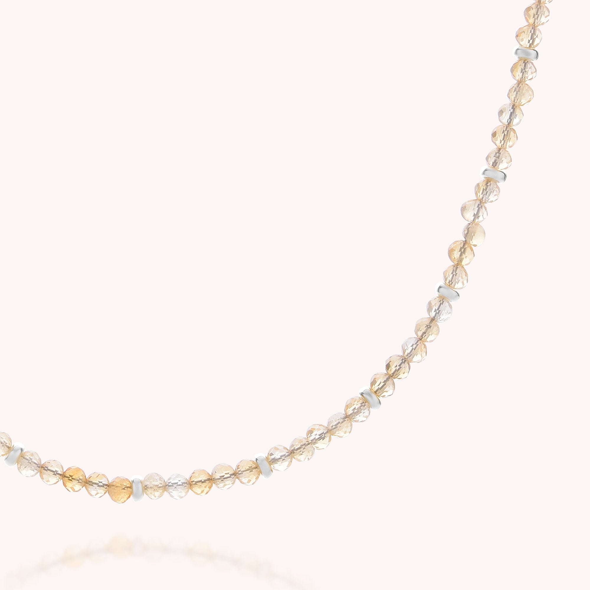 Introducing the Citrine November Birthstone Orbit Necklace—a delicate handcrafted jewelry piece featuring small, round citrine beads paired with alternating gold and silver accents, all arranged on a thin, nearly invisible string that stands out beautifully against a light background.