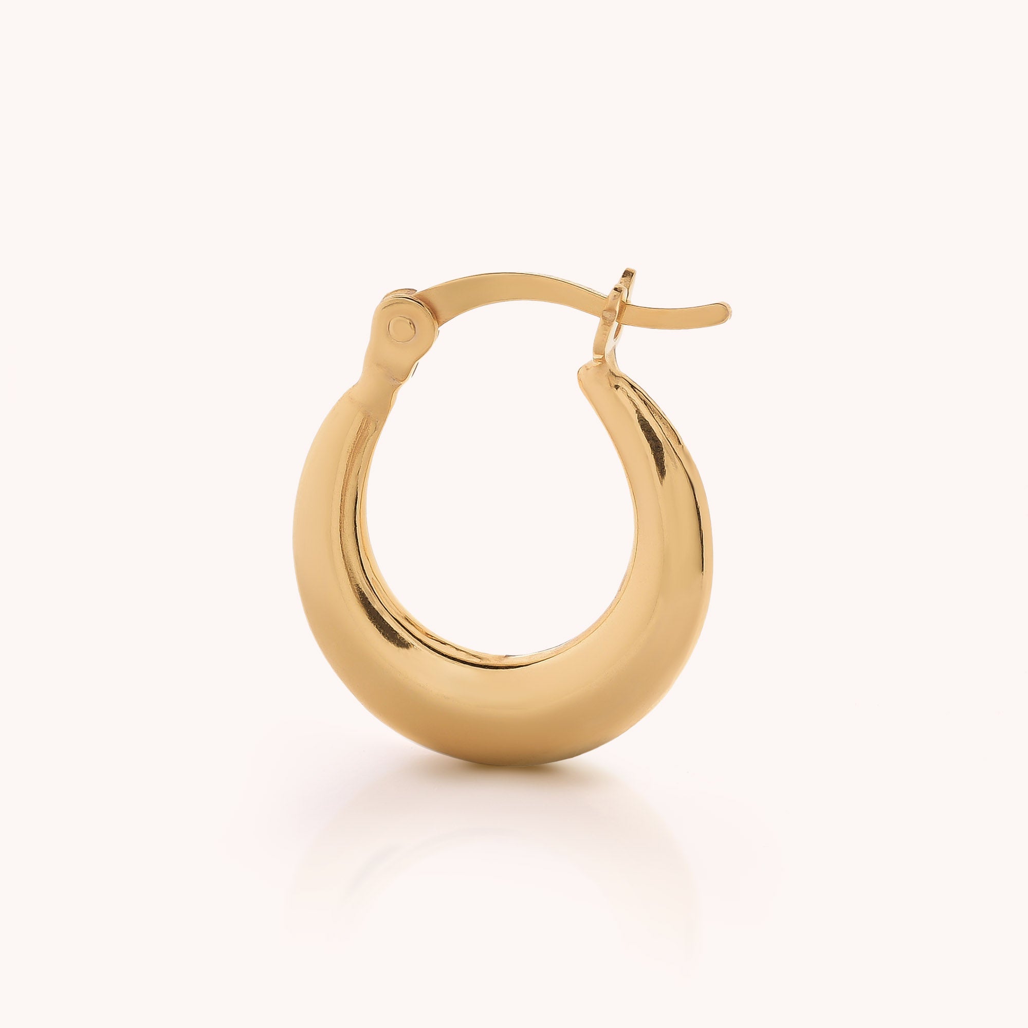 A single Contour Hoop Earring in gold with a smooth polished finish and a hinged clasp, displayed against a plain light background.