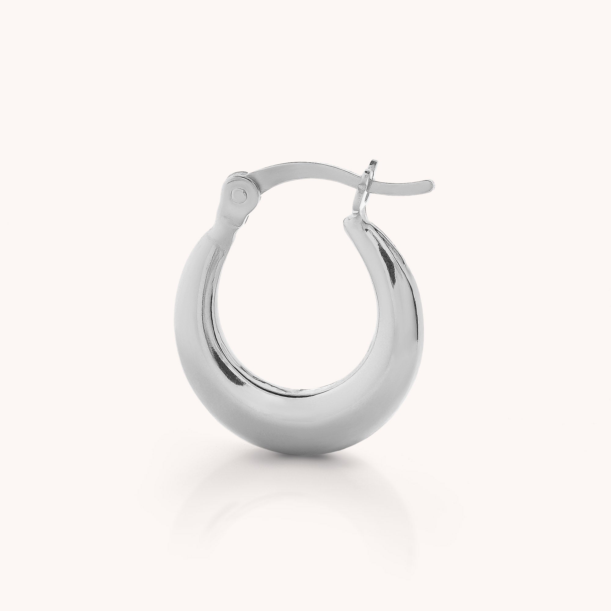 A single Contour Hoop Earring, crafted in polished sterling silver with a thick, rounded design and a hinged clasp, displayed on a plain light background.