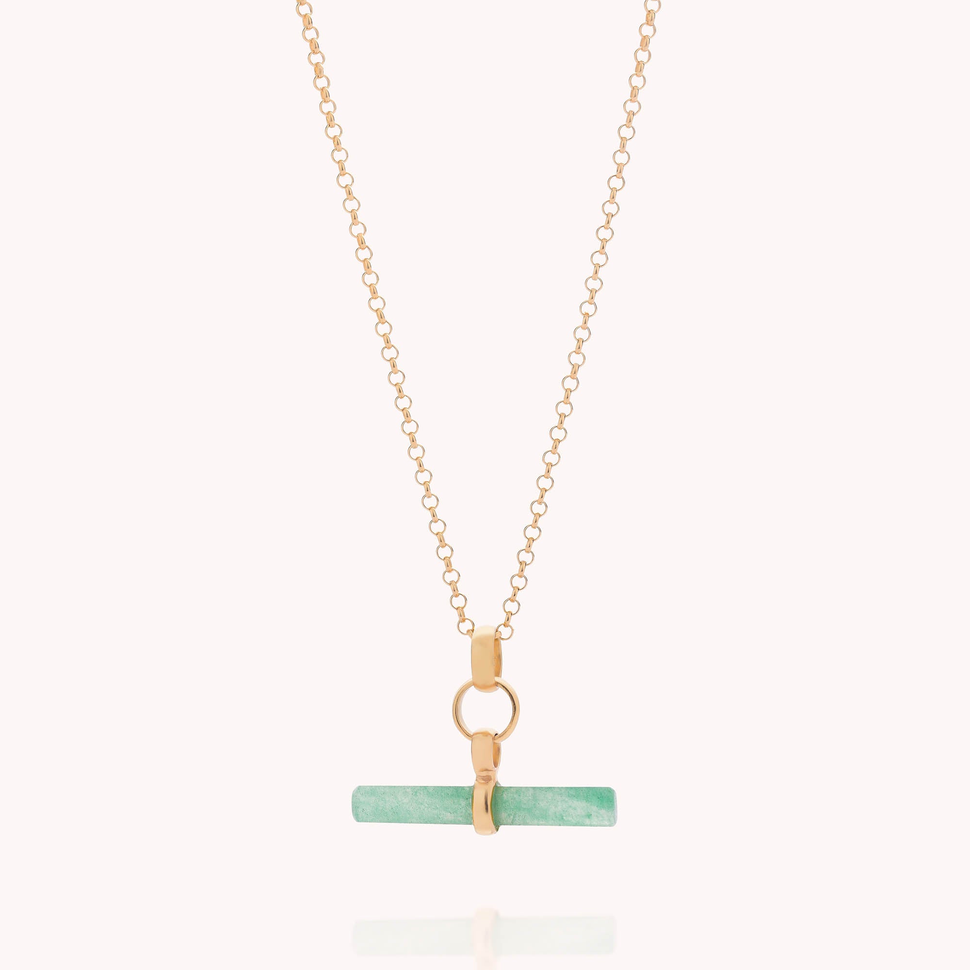 The Gemstone T Bar Necklace features a horizontal green stone bar pendant on a gold chain with a gold clasp, shown against a plain white background.