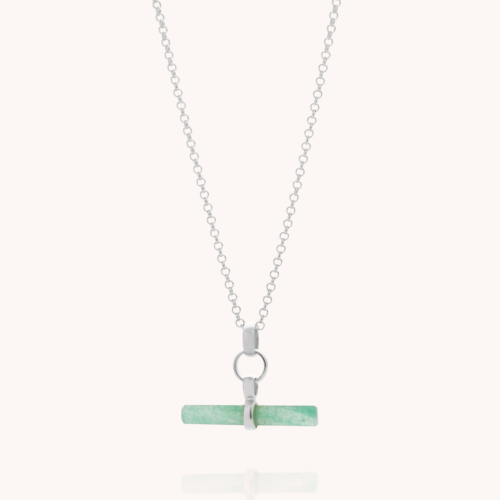Introducing the Green Aventurine T-Bar Necklace: a sterling silver chain featuring a horizontal light green aventurine pendant, secured with a silver clasp and ring. Displayed on a plain white background, this elegant piece of gemstone jewellery is perfect for any occasion.