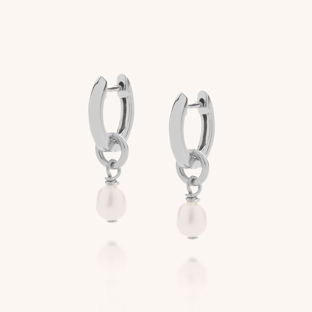Mini white freshwater pearls dropped from a silver ear hoop