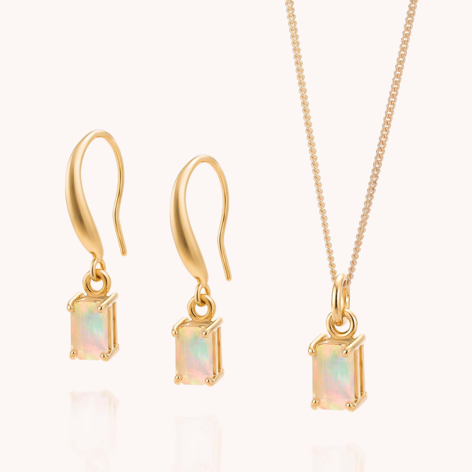 Opal Octavia Necklace & Earrings Set, featuring rectangular Ethiopian opal gemstones set in gold and displayed on a light background. The earrings include hook-style backs, while the necklace showcases a simple gold chain. This elegant jewellery set highlights the beauty of Ethiopian opal, making it a perfect gift for those who cherish the October birthstone.