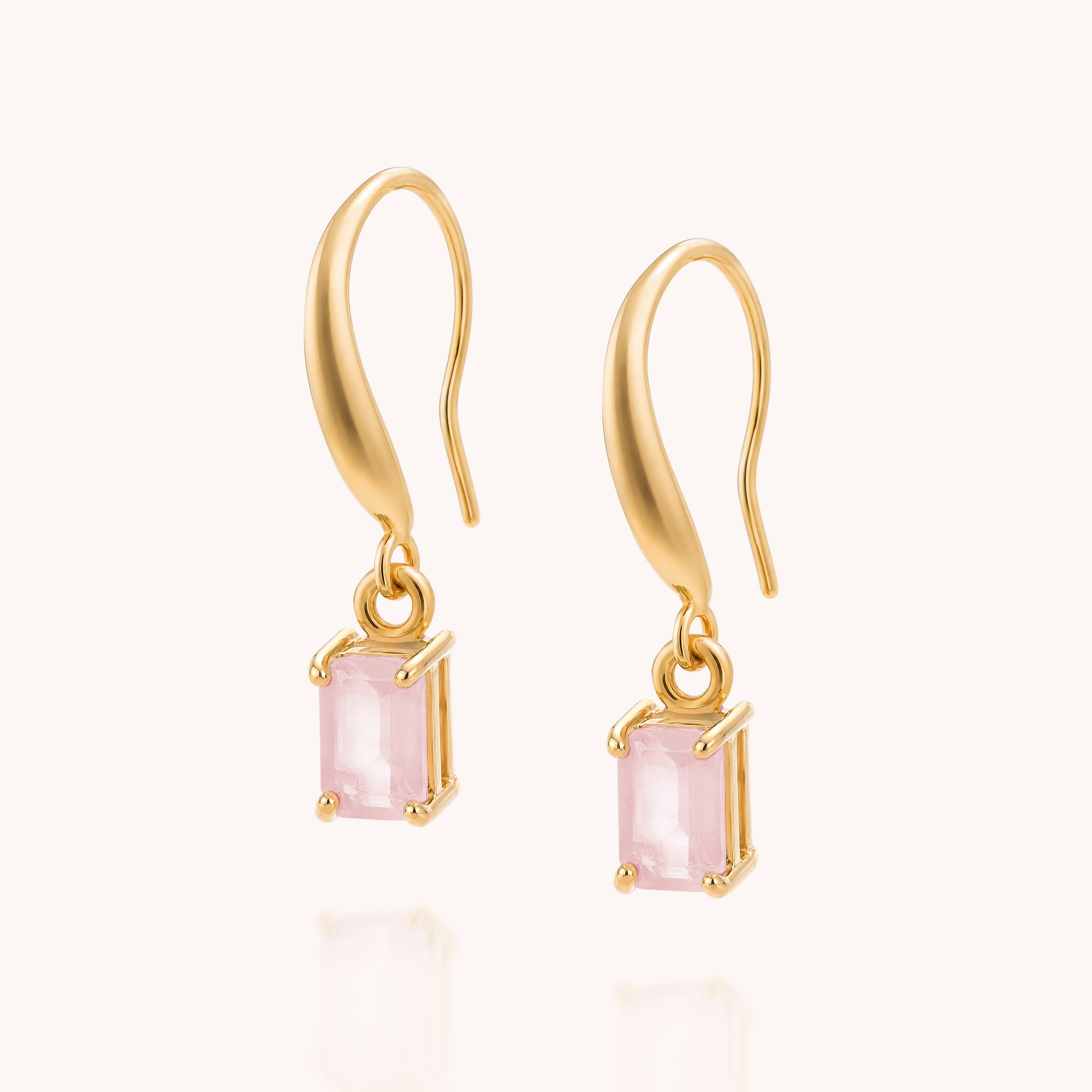 Rose Quartz Octavia Drop Earrings featuring rectangular pink gemstones set in gold prongs, reminiscent of classic Rose Quartz designs, photographed against a plain light background.