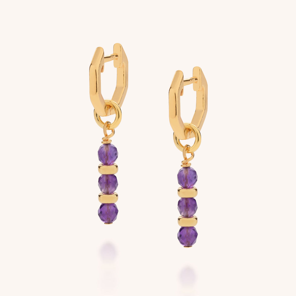 Pair of gold earhoops with amethyst February birthstone