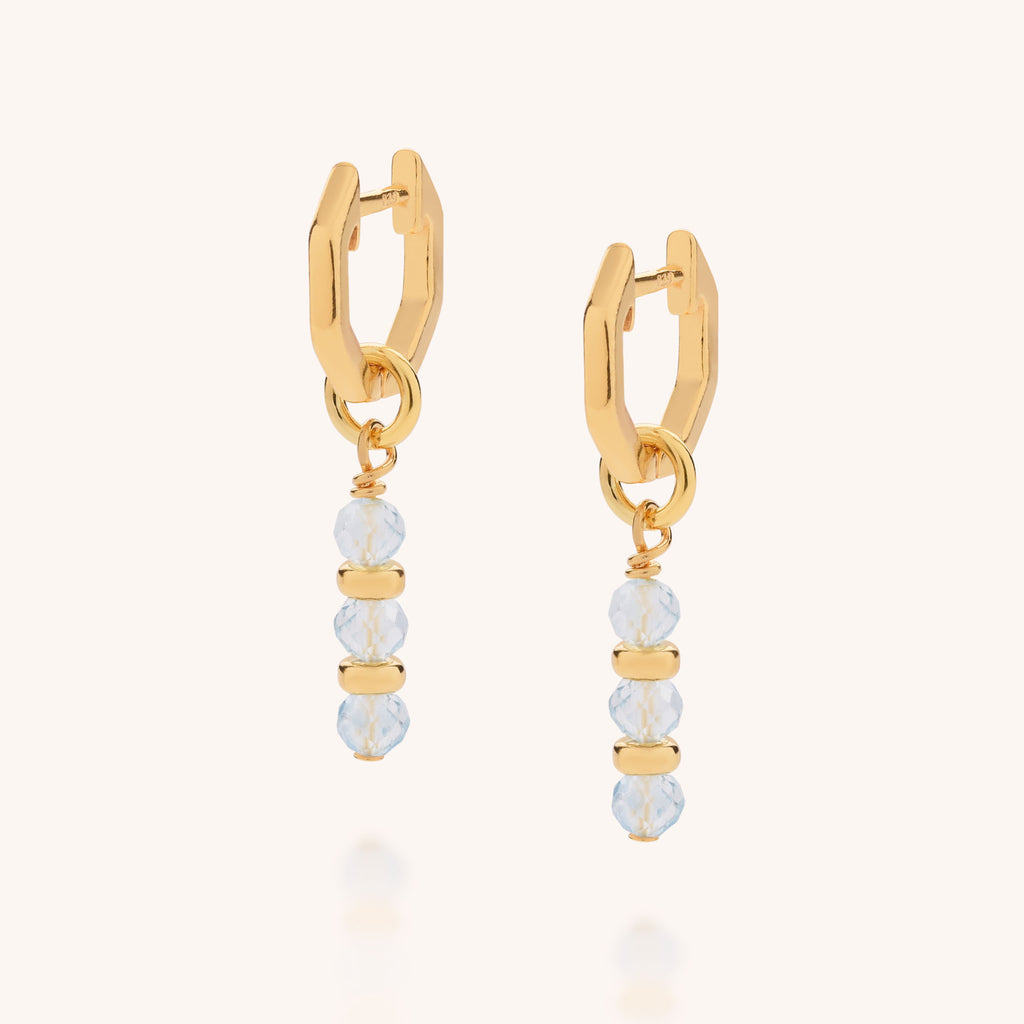 Pair of huggie earrings in aquamarine march birthstone