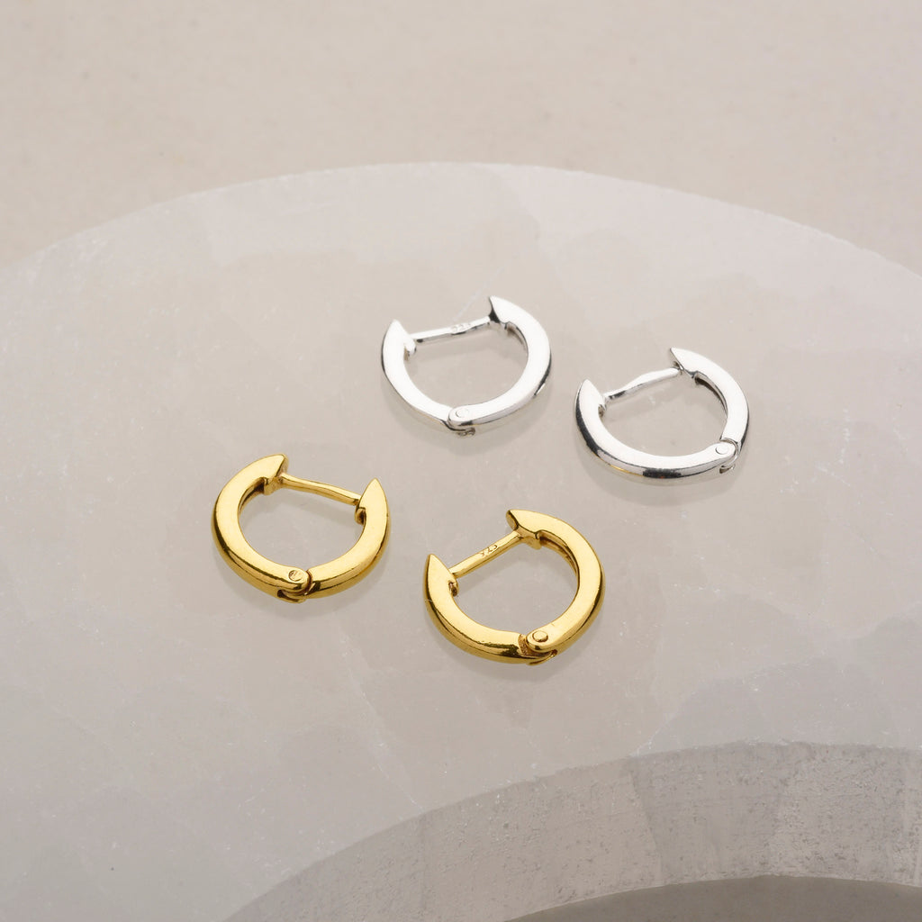 Pair of round ear hoops in gold and silver
